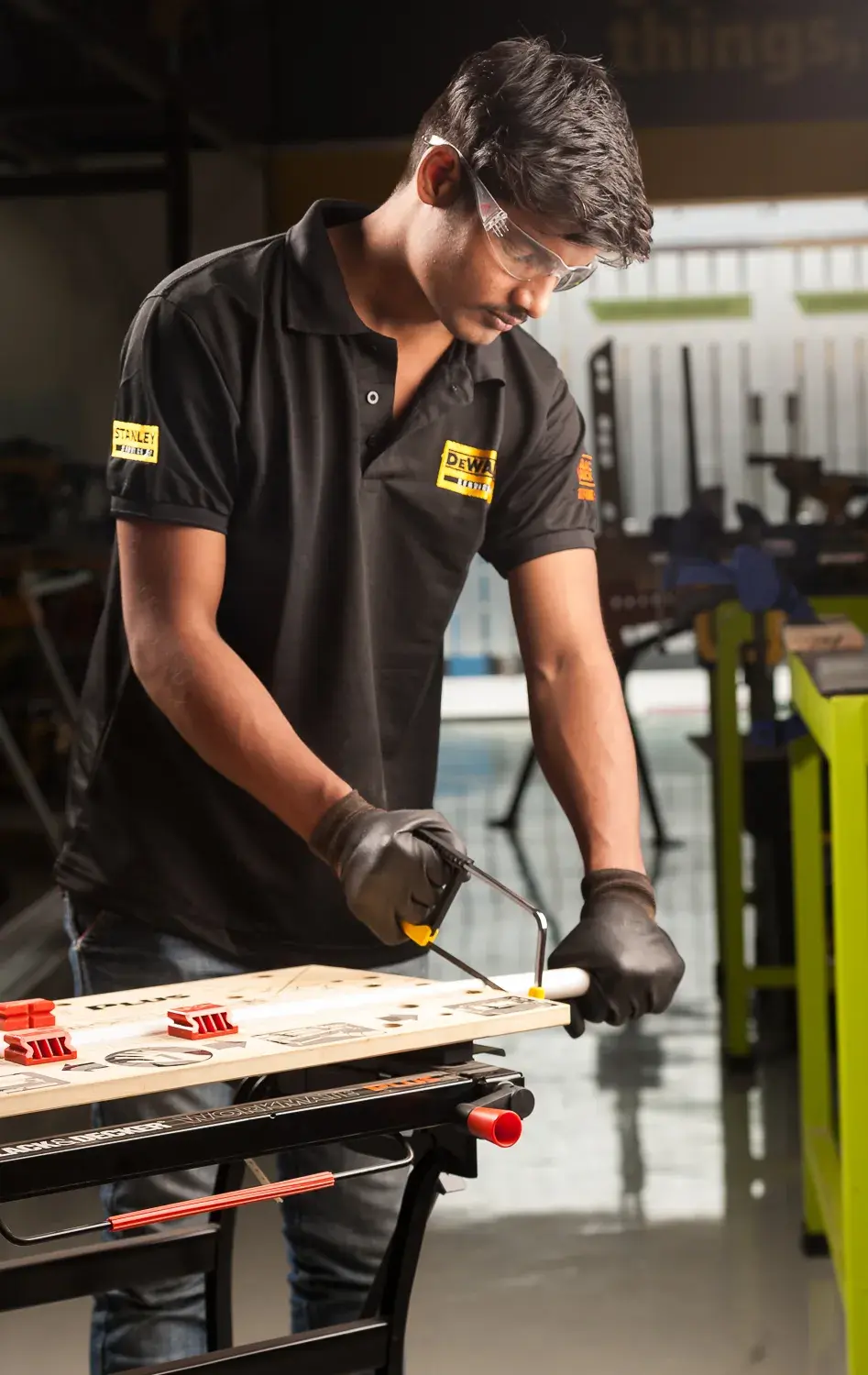 STANLEY 0-15-218 hand saw photography, side angle, shown in use on a workbench.