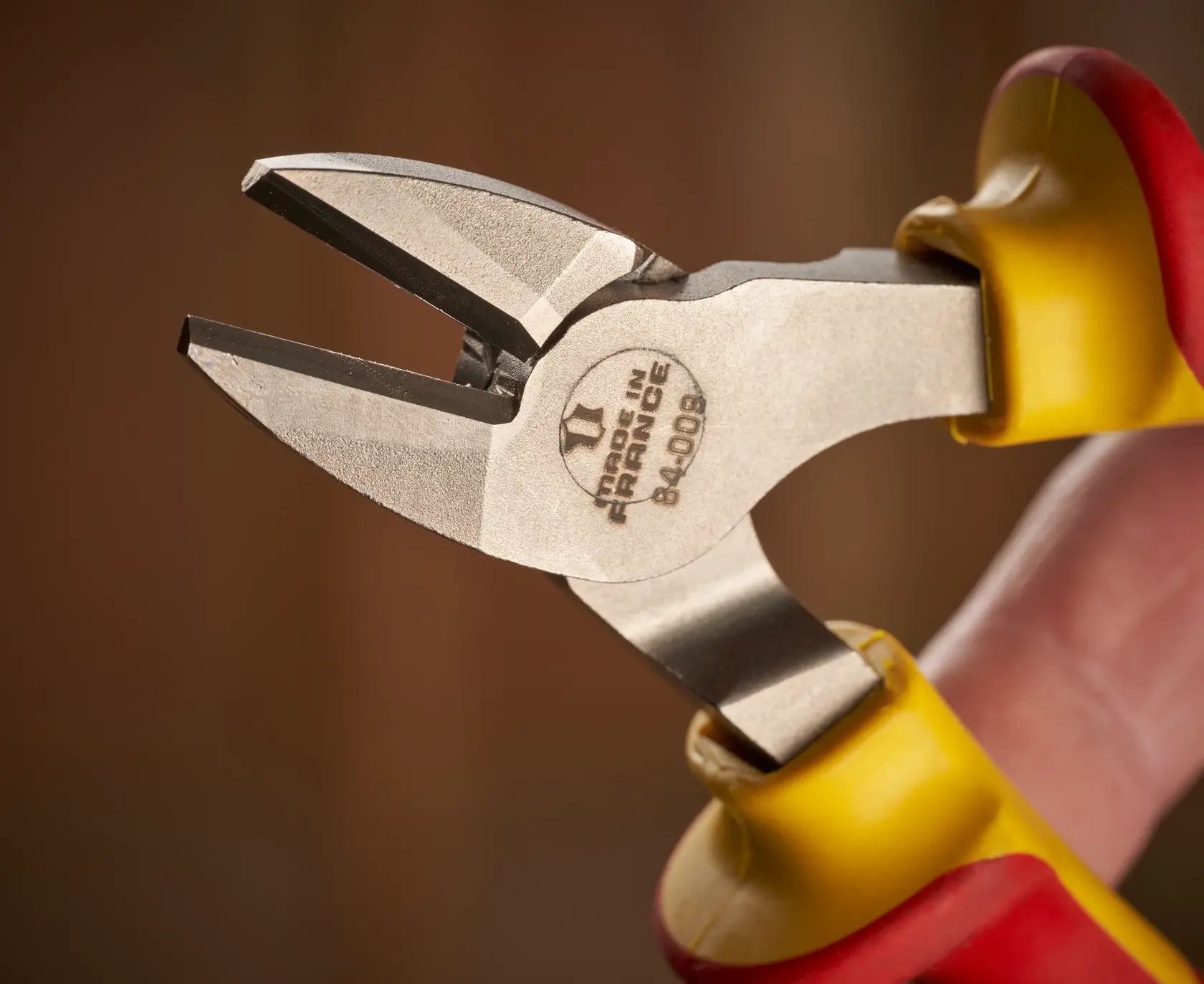 STANLEY 0-84-009 insulated diagonal cutting pliers close-up, yellow and red handles, product photography.