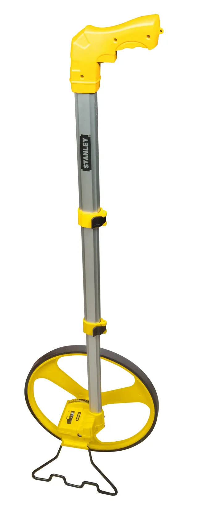 STANLEY 1-77-174 measuring wheel with yellow handle and foldable aluminum shaft, side view on white background.