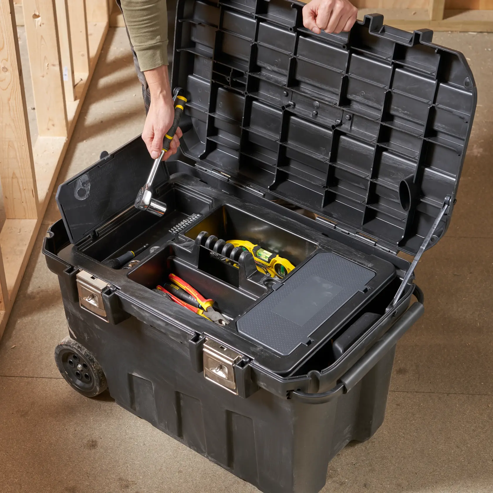 STANLEY 1-92-978 rolling tool chest with opened lid, showing organized tools inside, angled front view.